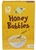 BONI SELECTION (COLRUYT) BOULES DE MAÏS EXTRUDÉES ENROBÉES DE MIEL, ENRICHIES EN VITAMINES B1, B2, B3, B5, B6, B8, B9, B12 ET EN FER